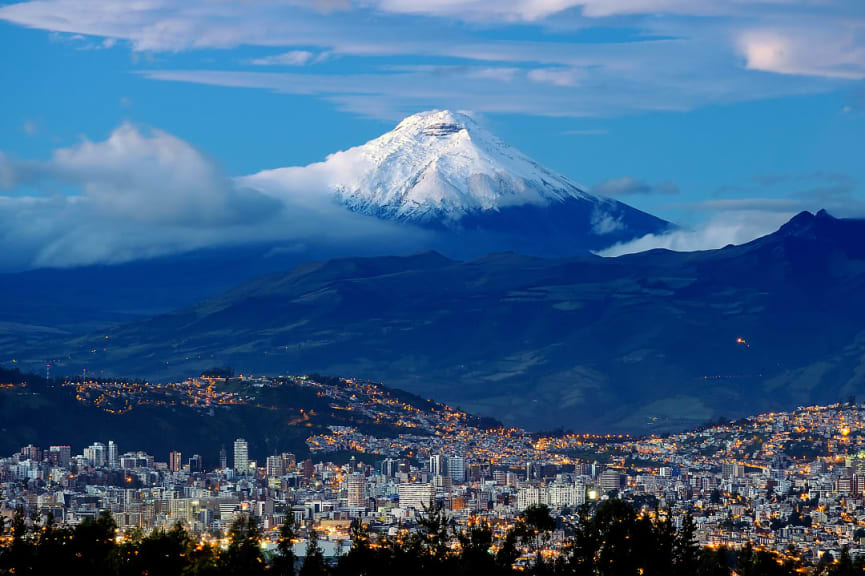 Quito city with Cotopaxi volcano in the background in Ecuador