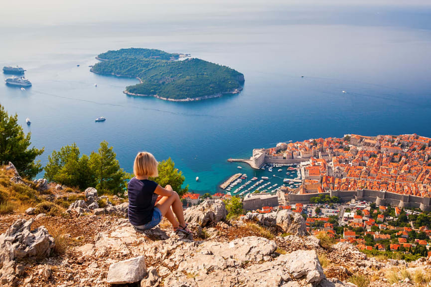 Woman enjoying the view of Old Town in Dubovnik, Croatia