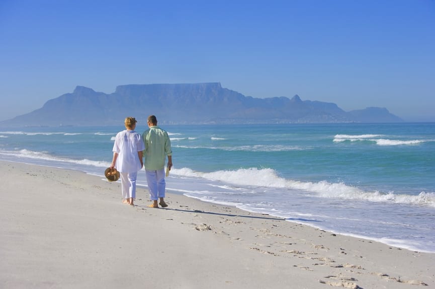 Senior couple on the beach with a view of Table Mountain in Cape Town, South Africa