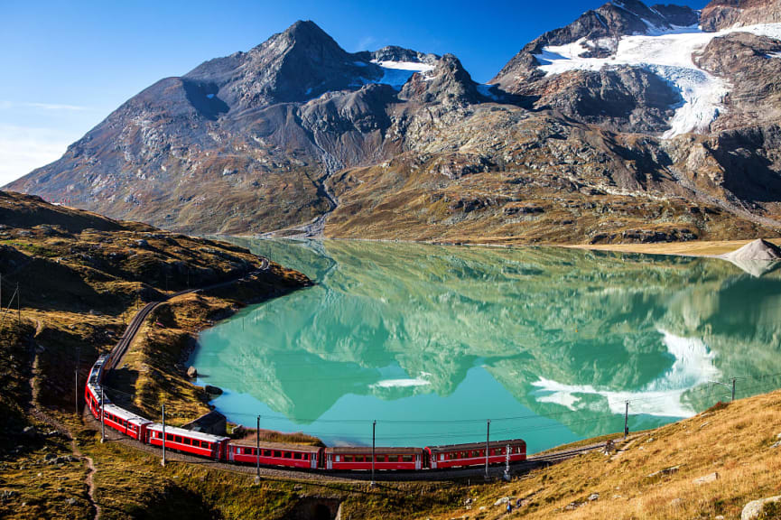 Train passing by the Swiss Alps in Switzerland