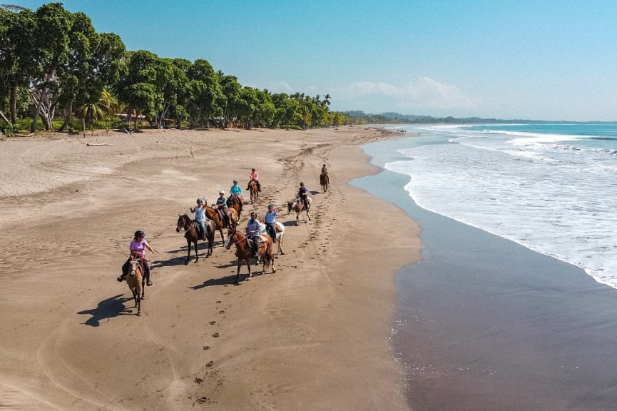 Family group horseback riding in Puntarenas, Costa Rica