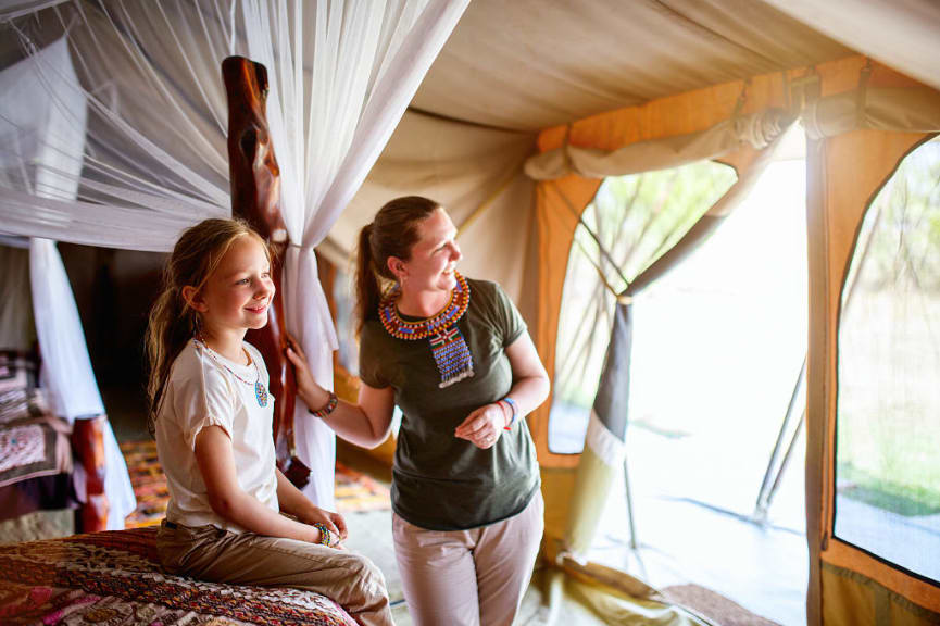 Mother and daughter in safari tent