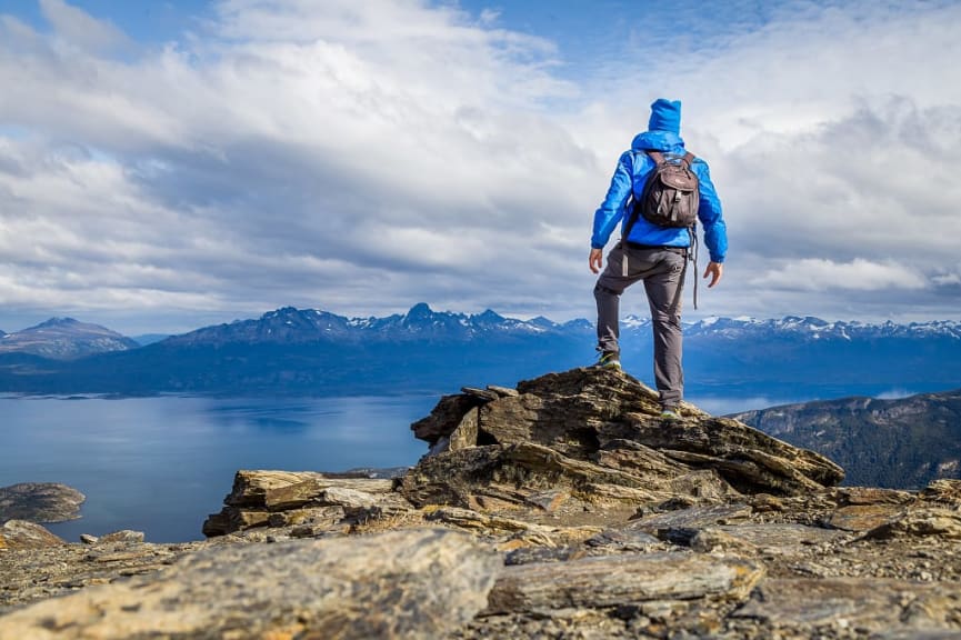 Man hiking in Ushuaia, Argentina with views the Martial Mountains and the Beagle Channel