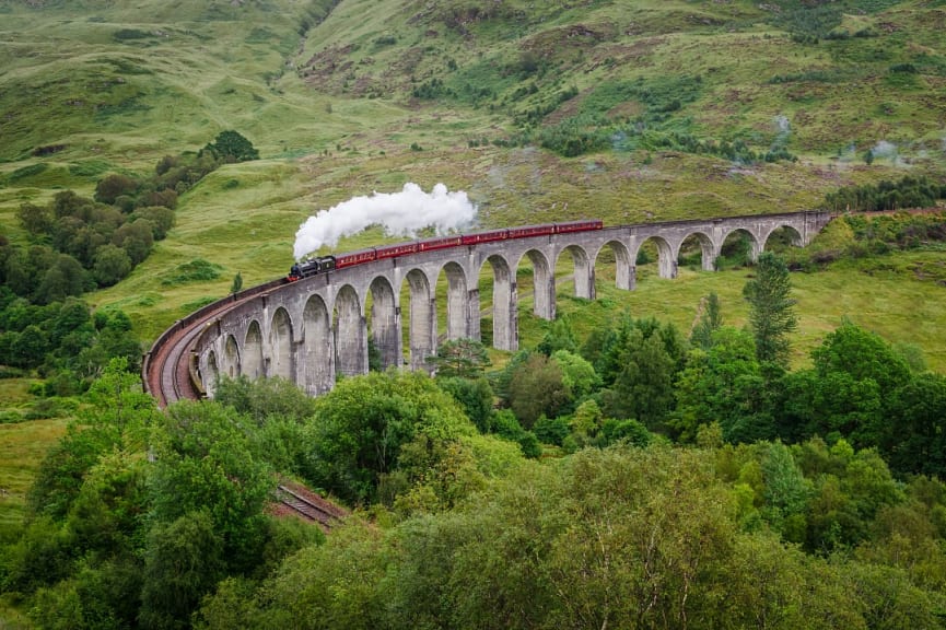 Steam train on the famous Glenfinnan Viaduct in Scotland