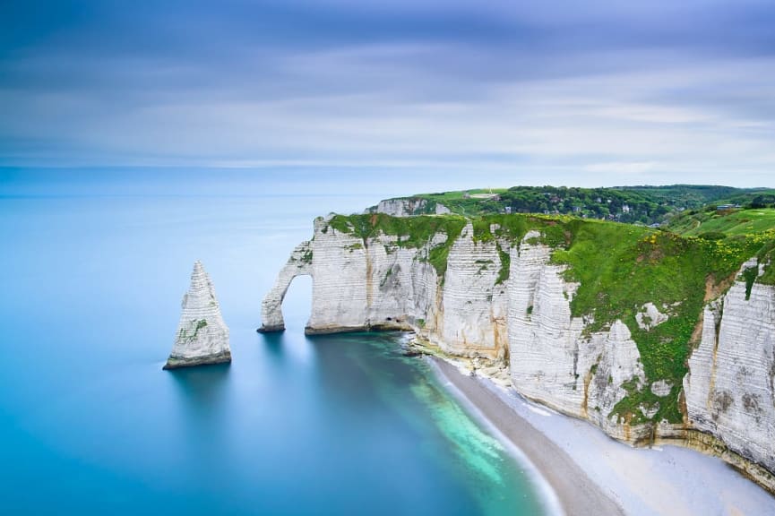 Etretat Aval cliff rocks and natural arch in Normandy, France.