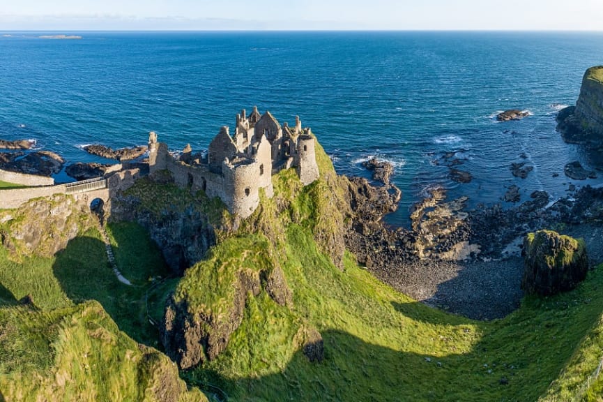 Ruins of medieval Dunluce castle on a steep cliff. northern coast of County Antrim, Northern Ireland