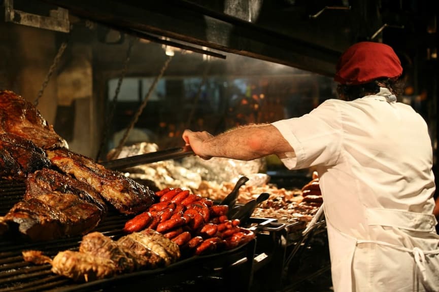 Chef grilling traditional Argentinian asado in Buenos Aires