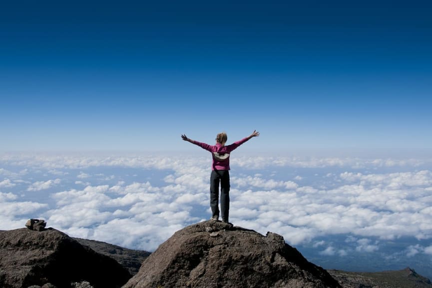 Hiker on summit of Mount Kilimanjaro, Tanzania