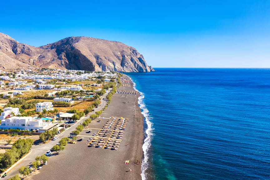 Black sand Perissa Beach on Santorini island, Greece