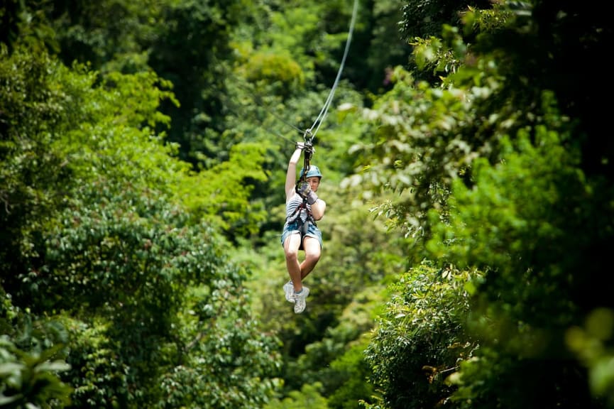 Teen girl zip-lining in Costa Rica