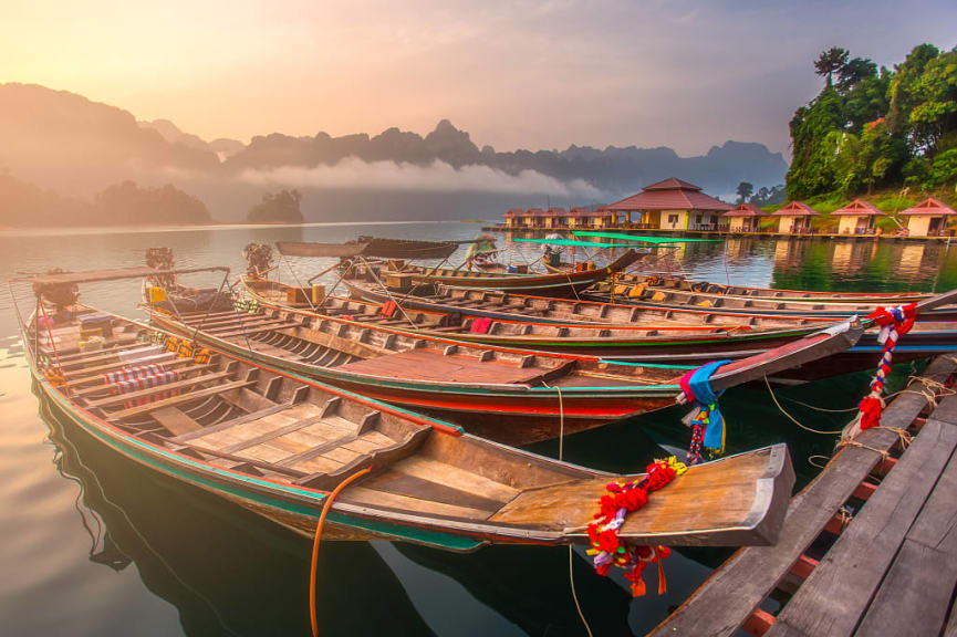 Boats moored at Ratchaprapha Dam in Khao Sok National Park, Thailand