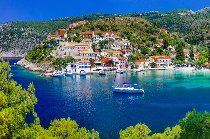 Sailing yacht mored in the bay at Assos on Kefalonia island, Greece.