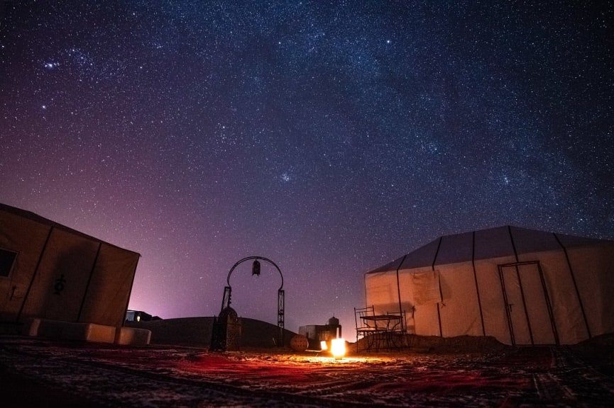 Starry night sky over luxury camp in the Sahara Desert, Morocco