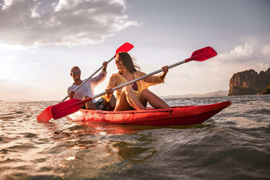 Happy couple kayaking in Thailand