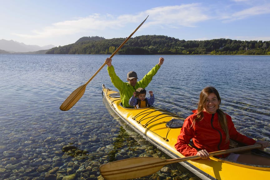 Family kayaking Nahuel Huapi Lake in Bariloche, Argentina