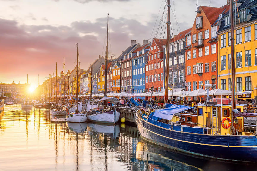 Old  Nyhavn Port in Copenhagen, Denmark at sunset