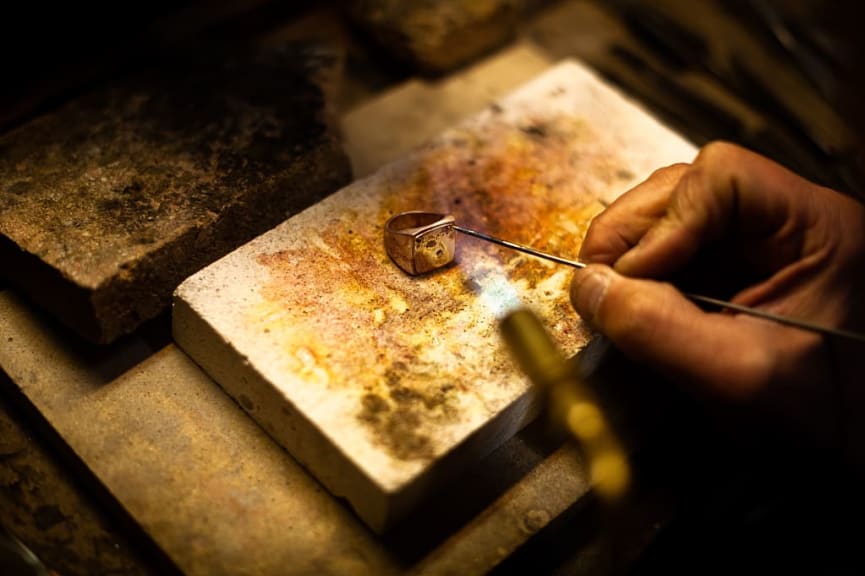 Jeweler working on traditional silver ring in Florence, Italy