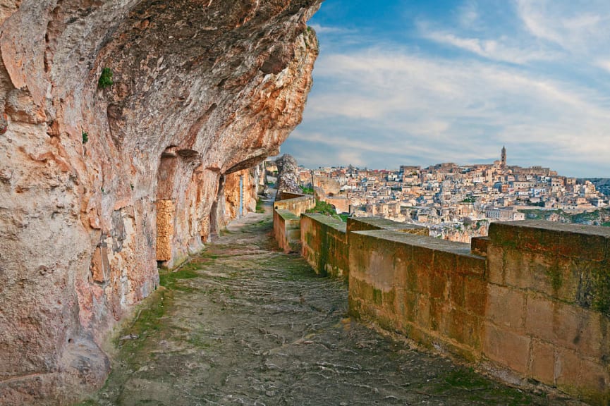 Alley carved in the rock with the old cave houses in the ancient Italian city Matera