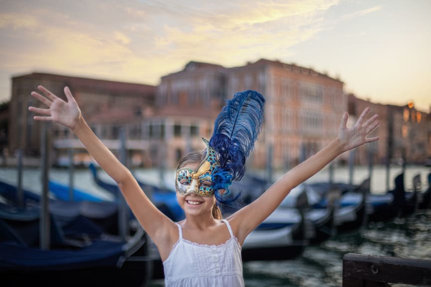 Girl wearing carnival mask in Venice, Italy