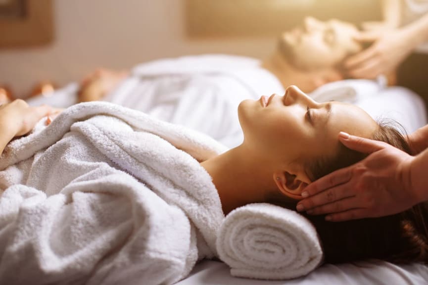 Couple receiving a head massage 