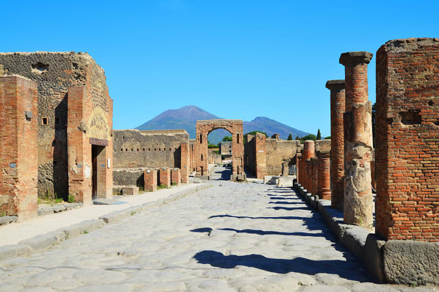 Ruins of ancient city Pompeii with Vesuvius volcano in Italy