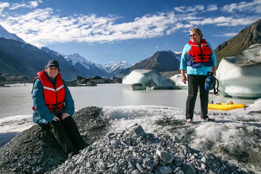 Mother and son at Tasman Lake in Mount Cook National Park, New Zealand