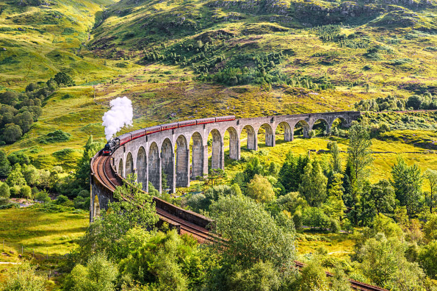  Jacobite Steam Train over the Glenfinnan Railway Viaduct in Scotland, UK