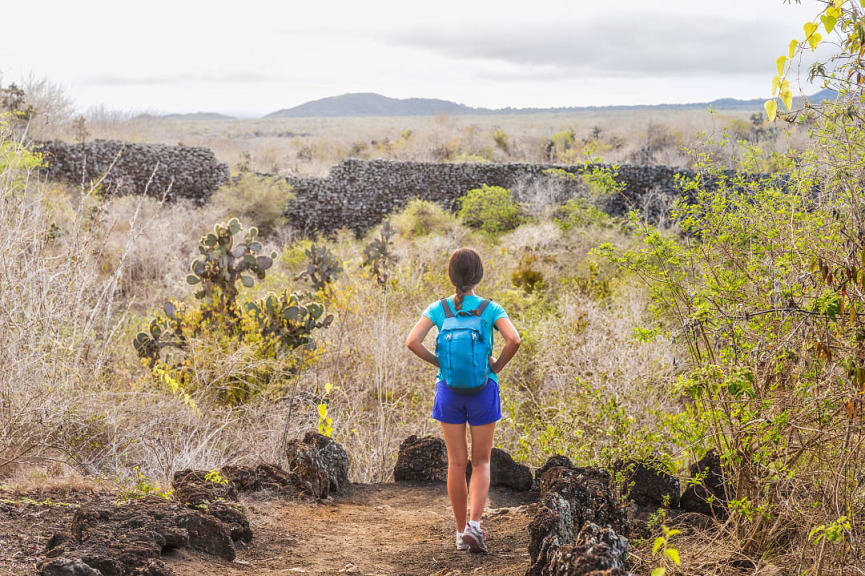 Traveler exploring the Wall of Tears on Isabela Island, Galapagos