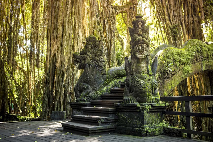 Dragon sculptures on bridge in Ubud Monkey Forest, Bali. 