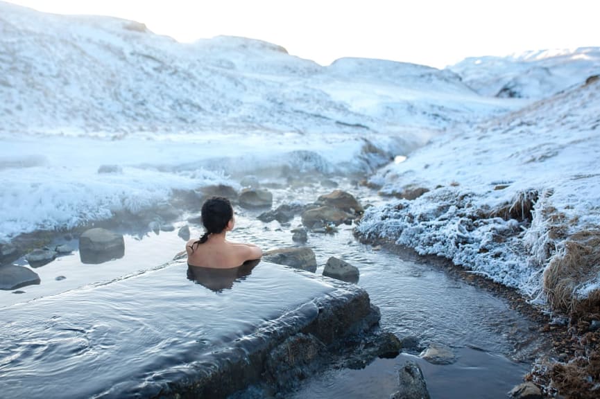 Woman enjoying a geothermal bath in Iceland