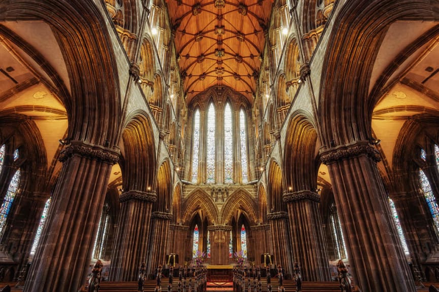 Gothic interior of Glasgow Cathedral with stained glass windows
