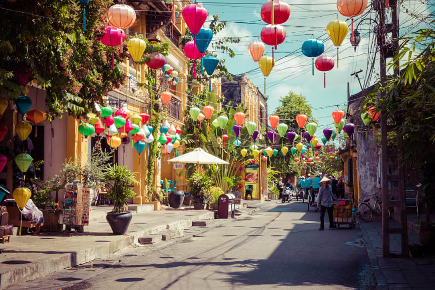 Colorful lanterns strewn across a narrow street in Hoi An, Vietnam