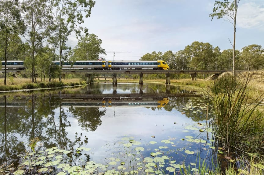 Tilt train traveling over a creek in Queensland 