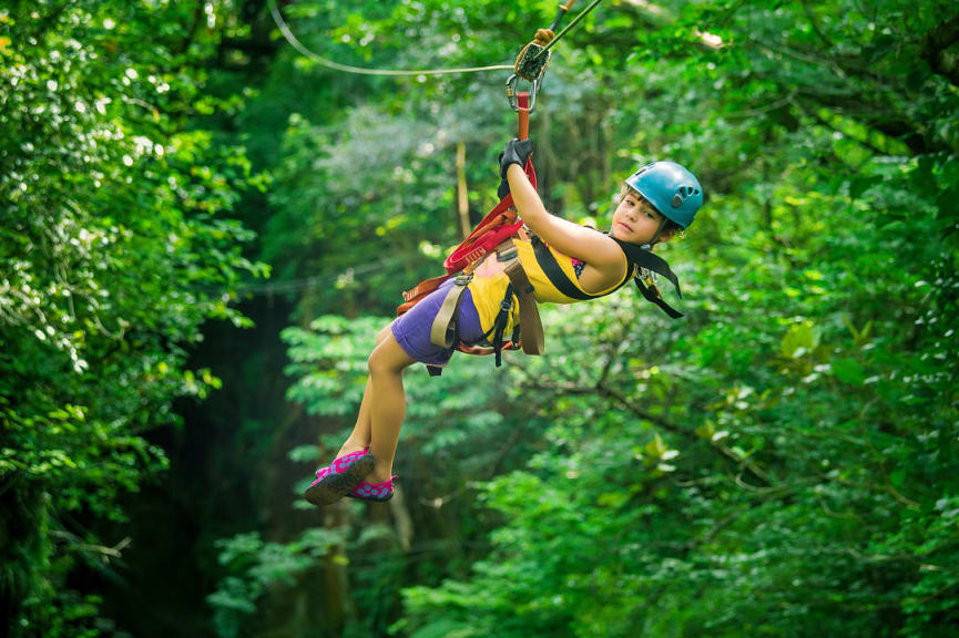 Young girl zip lining in Costa Rica