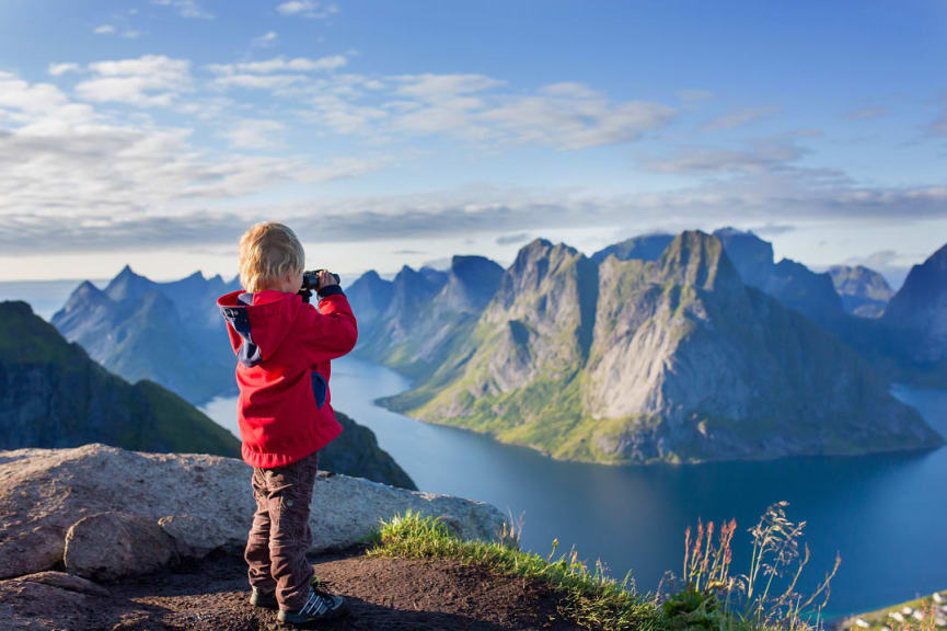 Kid enjoying nature and view in Lofoten, Norway