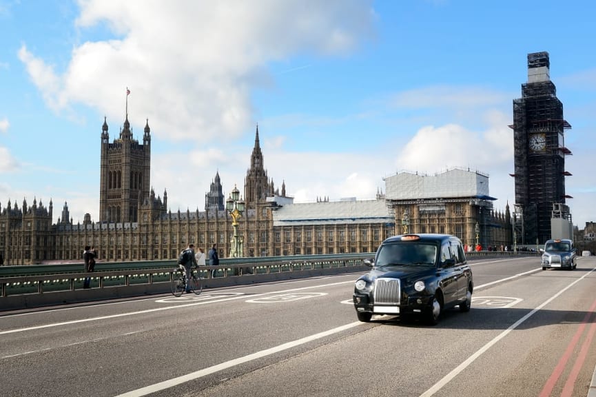 Black taxi on London street, England