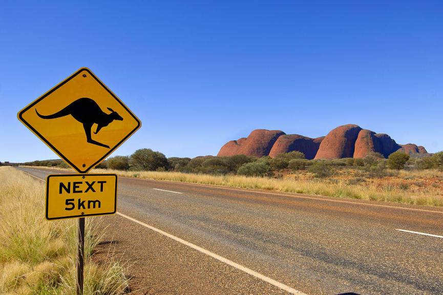 Road with Kata Tjuta in the background, Uluru, Australia.