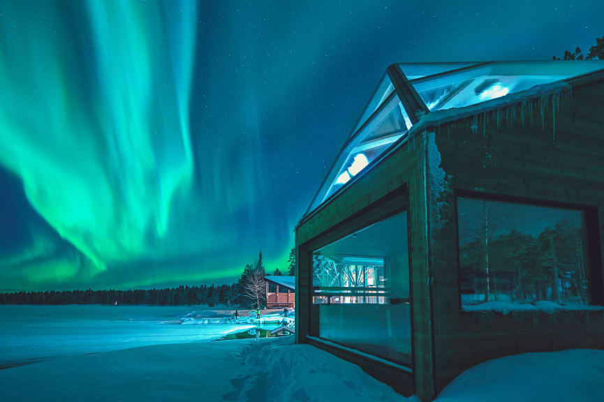 Northern lights over Jeris Arctic Sauna World in Lapland, Finland