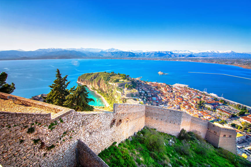 Old town of Nafplion with small port and Bourtzi Castle on the Mediterranean sea viewed from Palamidi Castle