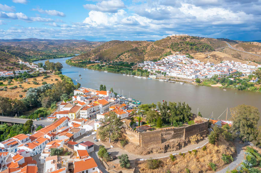 Walls of  Castelo de Alcoutim and the Spanish town of Sanlucar de Guadiana across the river