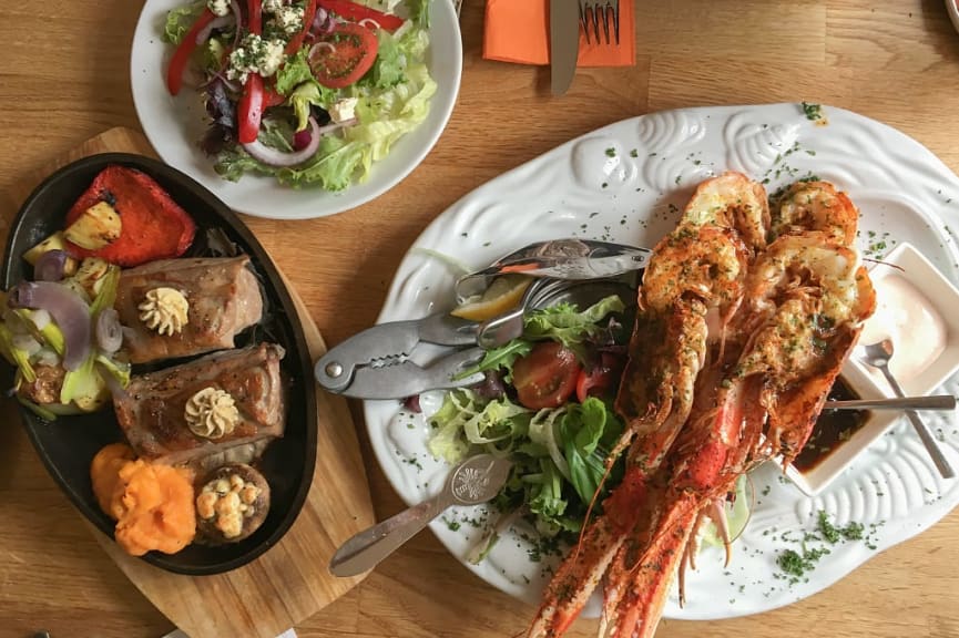 Fillet of lamb served with grilled langoustine and mixed salad