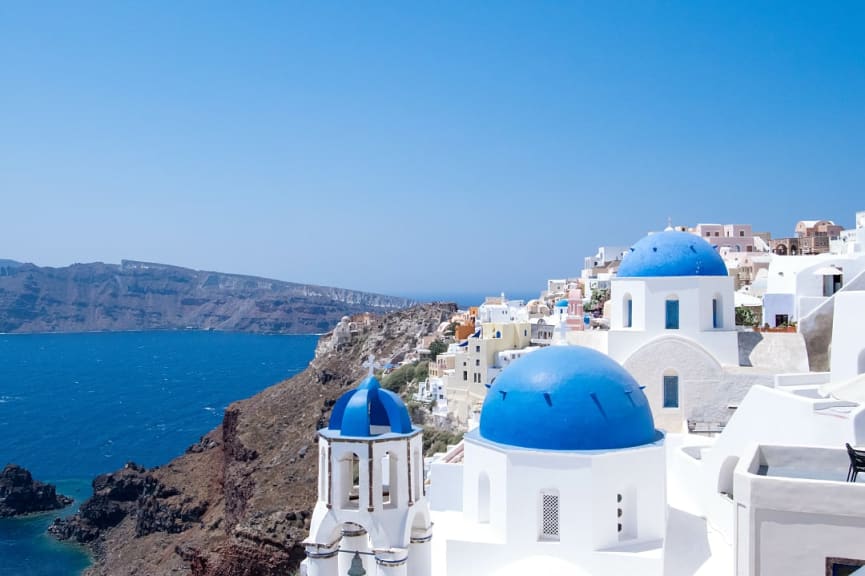 White washed buildings with blue domes in Santorini, Greece