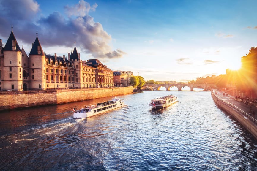 Cruise ships on River Seine at sunset in Paris