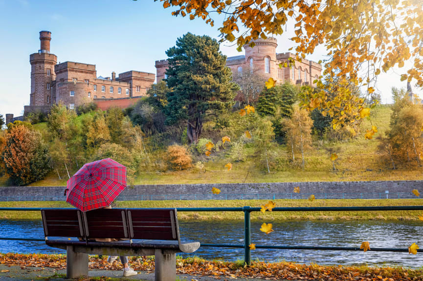 Tourist enjoying the view of Inverness Castle in Scotland