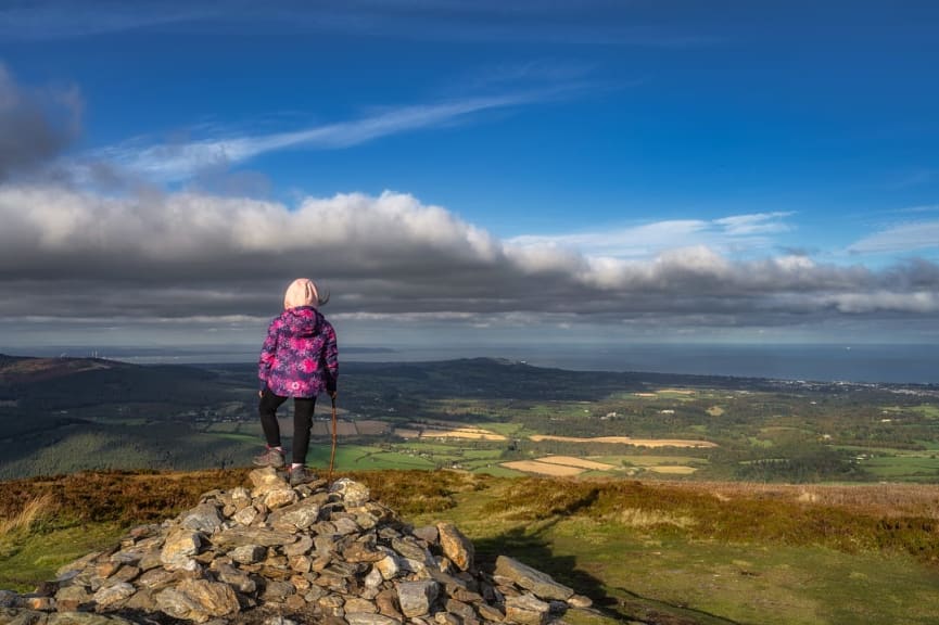 Young child at a hiking overlook in the Wickow Mountains of Ireland