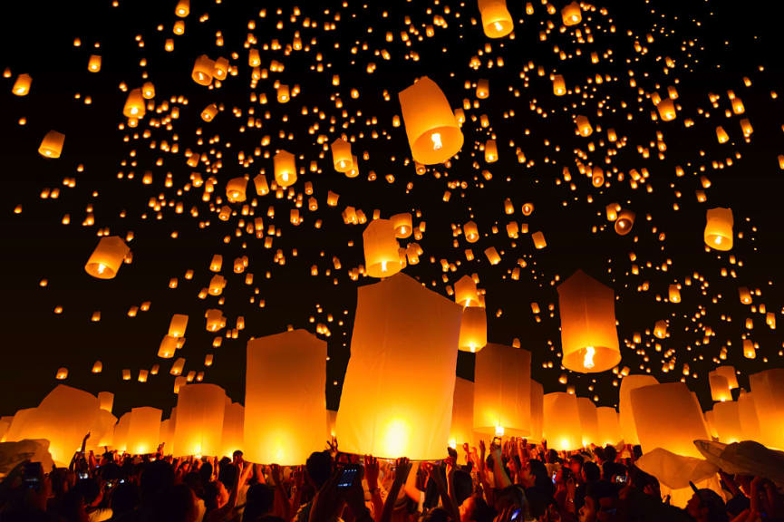 Lanterns drifting into the night sky in Chiang Mai, Thailand