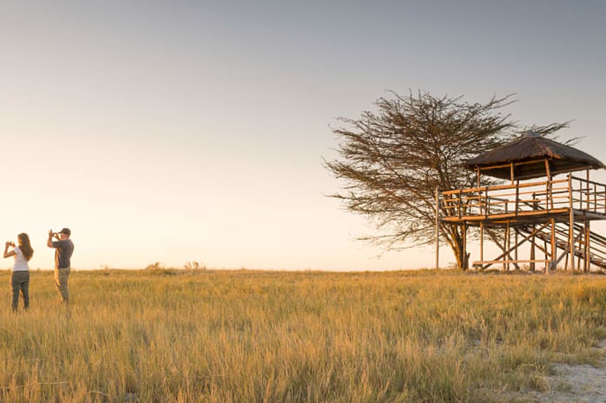 Couple on safari in the Makgadikgadi Pan, Botswana, Africa