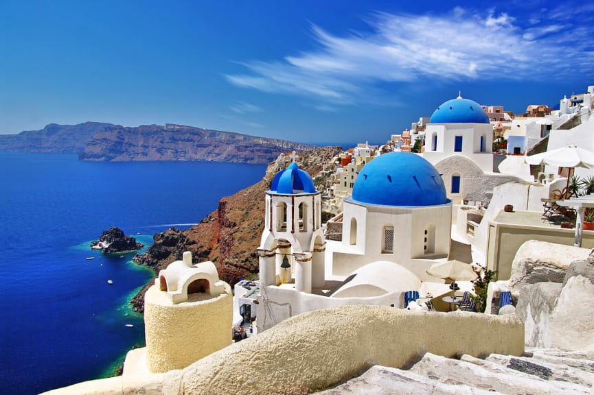 Santorini blue domes with caldera and ocean