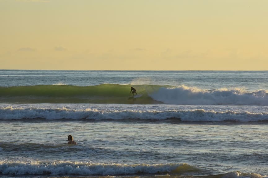 Surfer at Dominical Beach, South Pacific in Costa Rica