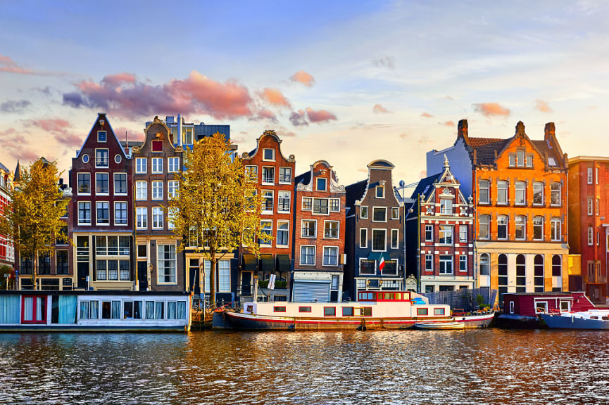 Colorful houses along the river in Amsterdam, Netherlands